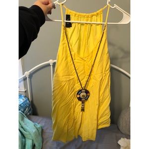 Flowy yellow shirt with attached necklace!